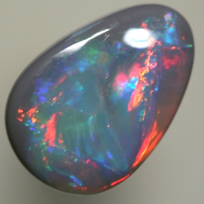 SOLID BLACK OPAL Very bright cherry reds move all over the face of the opal SEE VIDEO